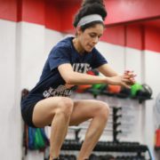 A women doing stretching in gym